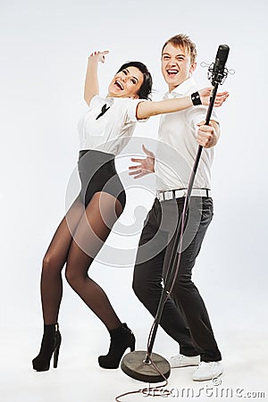 Performs duet singing microphone Stock Photo