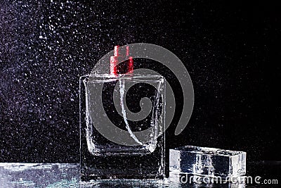 Perfume bottle and beautiful splashes of water Stock Photo