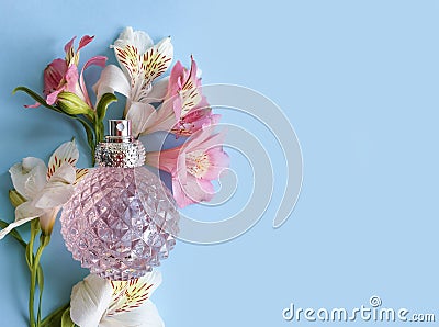 Perfume bottle flower summer romance springtime colored background essence Stock Photo