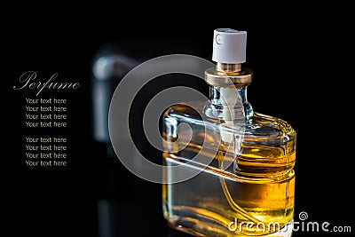 Perfume bottle isolated on black background with reflexion. Stock Photo