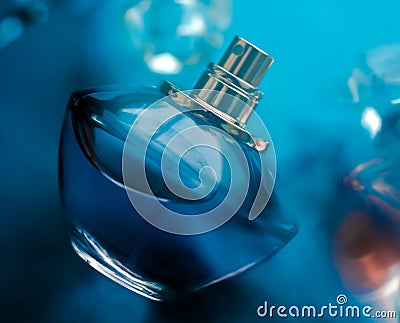 Perfume bottle under blue water, fresh sea coastal scent as glamour fragrance and eau de parfum product as holiday gift, luxury Stock Photo
