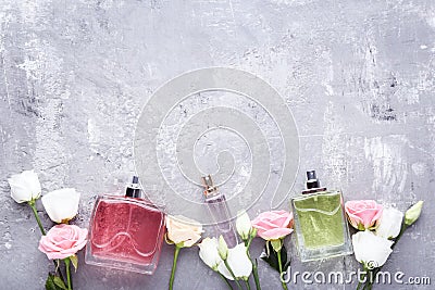 Perfume bottles with flowers Stock Photo