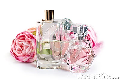 Perfume bottles with flowers on light background. Perfumery, cosmetics, fragrance collection Stock Photo