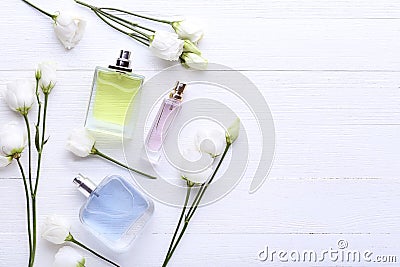 Perfume bottles with flowers Stock Photo