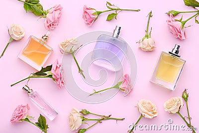 Perfume bottles with flowers Stock Photo