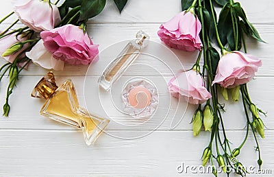 Perfume bottles with flowers Stock Photo