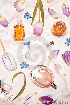 Perfume bottles on silk Stock Photo