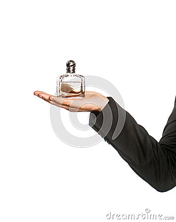 Perfume or cologne bottle and perfumery, cosmetics, scent cologne bottle, male holding cologne. Male holding up bottle Stock Photo