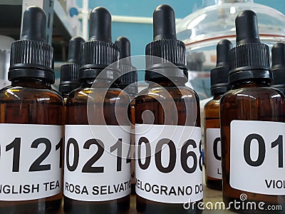 Perfume essence small brown bottles and vacuum bell Stock Photo