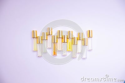 Perfume glass tester vials of different kinds on light background. Perfume sample. Stock Photo