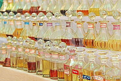 Perfume India. Oily Spirits India. Many beautiful bottles are in a row in the market bazaar of India, Goa Editorial Stock Photo