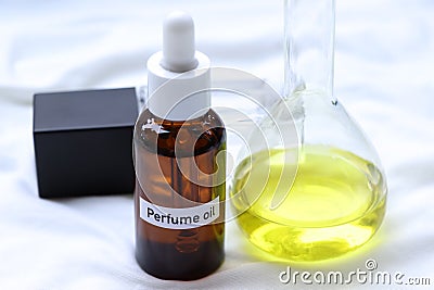 Perfume oil in Glass Bottle, yellow Perfume oil Stock Photo