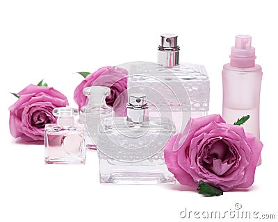 Perfumes with roses on white background Stock Photo