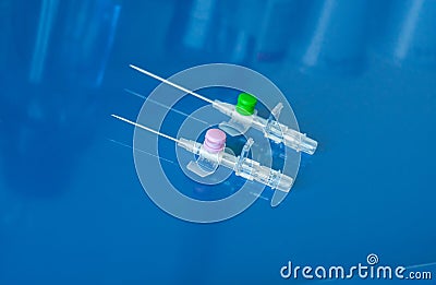 Peripheral venous catheters placed on the therapy trolley in the infirmary Stock Photo