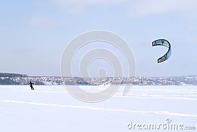 Snowkiter on the ice of the Kama Reservoir Editorial Stock Photo