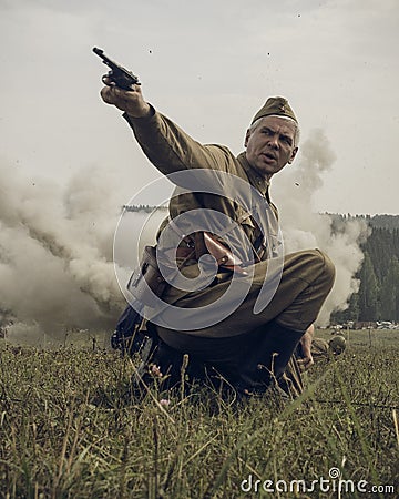 PERM, RUSSIA - JULY 30, 2016: Historical reenactment of World War II, summer, 1942. Soviet officer with pistol Editorial Stock Photo