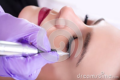 Enhancing Elegance: Professional Permanent Eyeliner Application Stock Photo