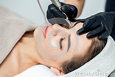 Permanent makeup on eyebrows of woman. Stock Photo