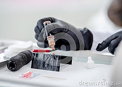 Master prepares tools for permanent makeup Stock Photo