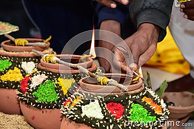 Permorming pooja with kalash in a special function in India Stock Photo