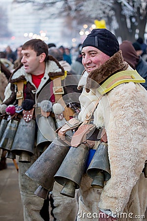 Proudly showing off and dancing with huge brass bells Editorial Stock Photo