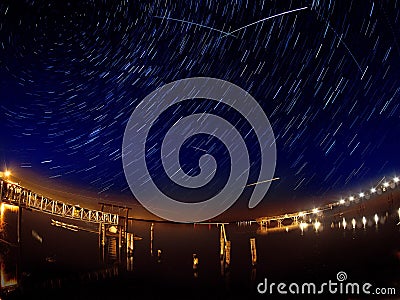 Perseid meteor shower with multiple meteor streaks and star trails Stock Photo