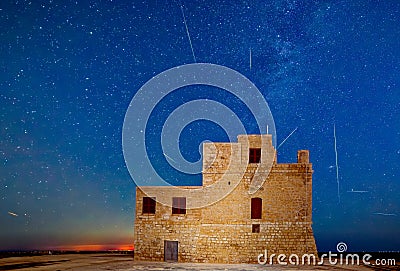 Perseids over Torri l-Abjad in Malta Stock Photo