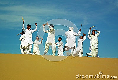 Persian folk dancers on sand dune in a festival in Eastern Iran Editorial Stock Photo