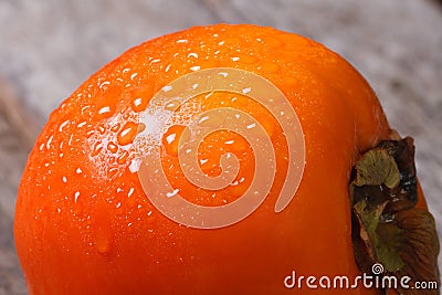 Persimmon close up with drops of water. macro. Stock Photo