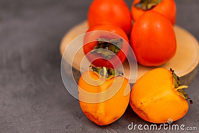 Persimmon on a dark background Stock Photo