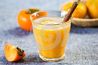 Persimmon with orange smoothie Stock Photo