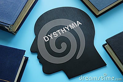 Persistent depressive disorder PDD dysthymia written on a head shape Stock Photo