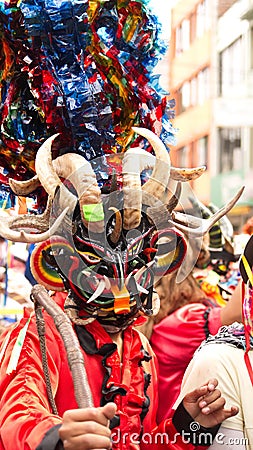 Person in a black devil mask Editorial Stock Photo