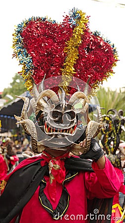 Person in a black devil mask Editorial Stock Photo