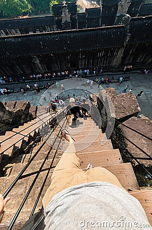 Person climbing down stairs Editorial Stock Photo