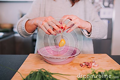 A person cooking eggs Stock Photo