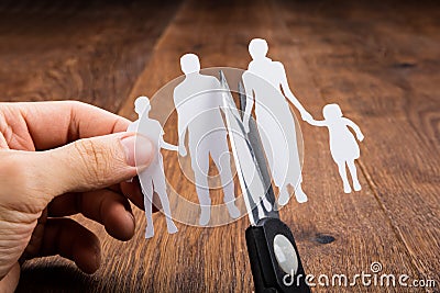 Person Cutting Papercut With Scissor Stock Photo