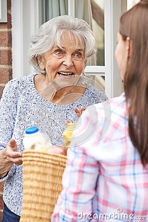 Person Doing Shopping For Elderly Neighbour Stock Photo