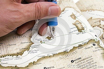 Person drawing route on map Stock Photo