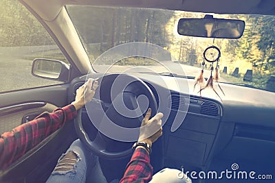 Person drives the car towards a new travel destination Stock Photo