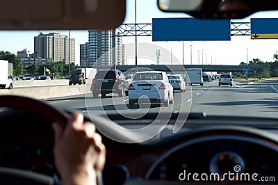 Person Driving Car on Highway Stock Photo