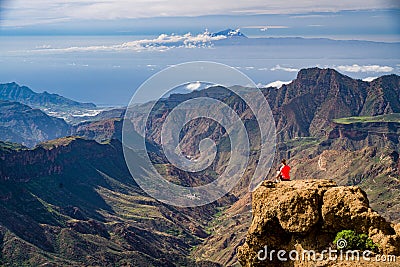 Person on the edge of a cliff in Gran Canary, Spain Editorial Stock Photo