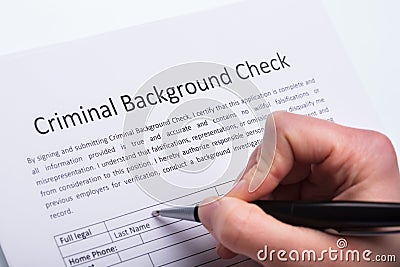 Person Filling Criminal Background Check Form Stock Photo