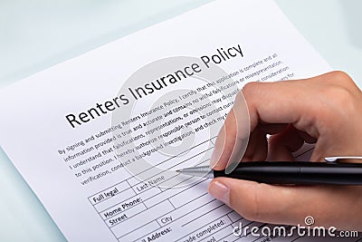 Person Filling Renters Insurance Policy Form Stock Photo