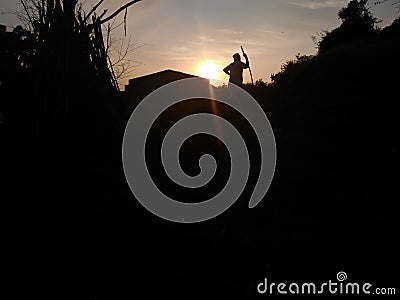 Person go back to their home with his cows Stock Photo