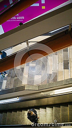 Person going up on escalators in the Mexico City subway Editorial Stock Photo