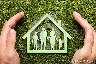 Person Hand Protecting Family Home Stock Photo