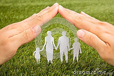 Person Hand Protecting Family Papercut Stock Photo