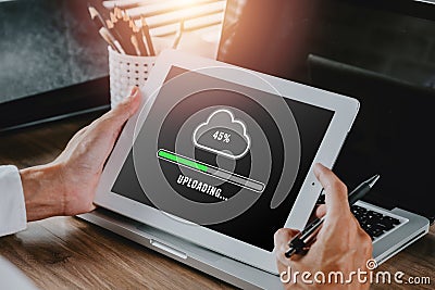 Person hand using and waiting for cloud uploading on digital tablet, Data infomation, Technology network Stock Photo