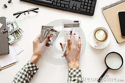 Person hands dollar with calculator in office Stock Photo